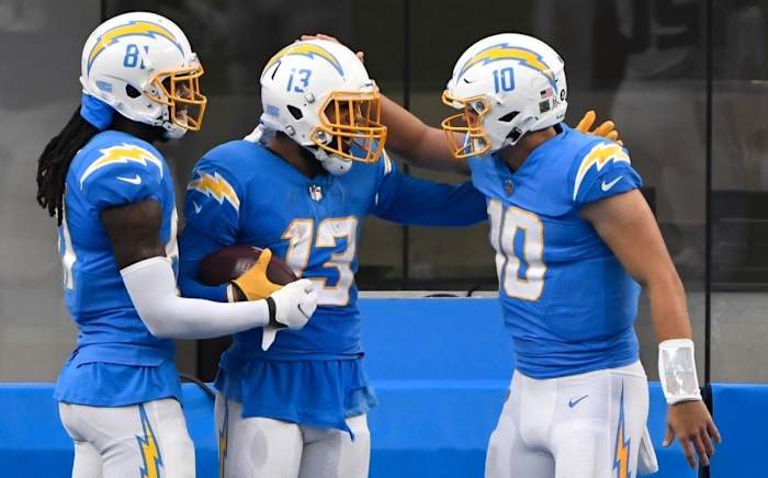 Los Angeles Chargers wide receiver Keenan Allen (13) celebrates with quarterback Justin Herbert (10) and wide receiver Mike Williams (81) after a touchdown in 2020. (Robert Hanashiro-USA TODAY Sports)